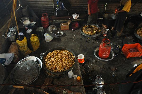 French fries, in a kitchen to feed hundreds of people, Tharlam Monastery of Tibetan Buddhism Courtyard, Boudha, Kathmandu, Nepal