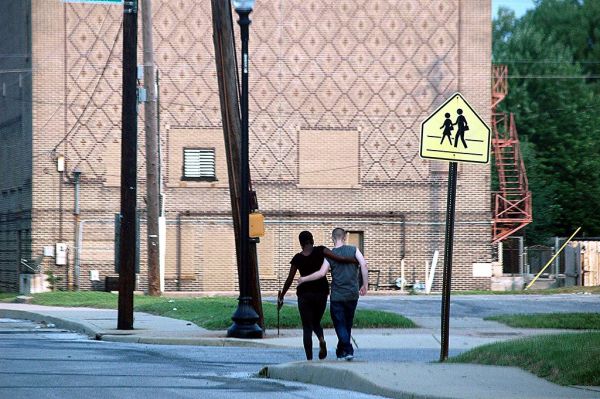 Not sure if the street sign is for a Lesbian crosswalk.