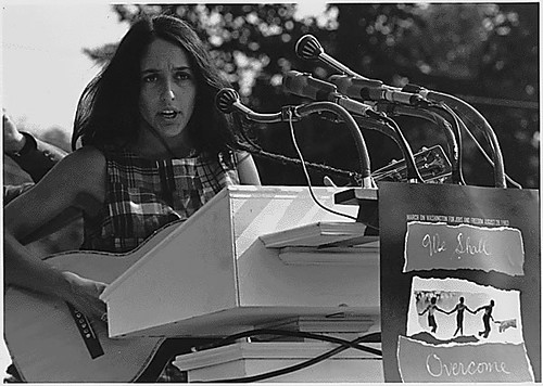 Public Domain: Joan Baez at 1963 March on Washington by USIA photographer (NARA)