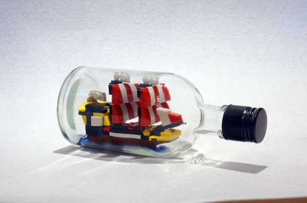 Tiny black seas barracuda in the bottle