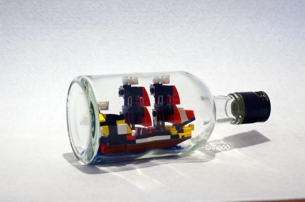 Tiny black seas barracuda in the bottle