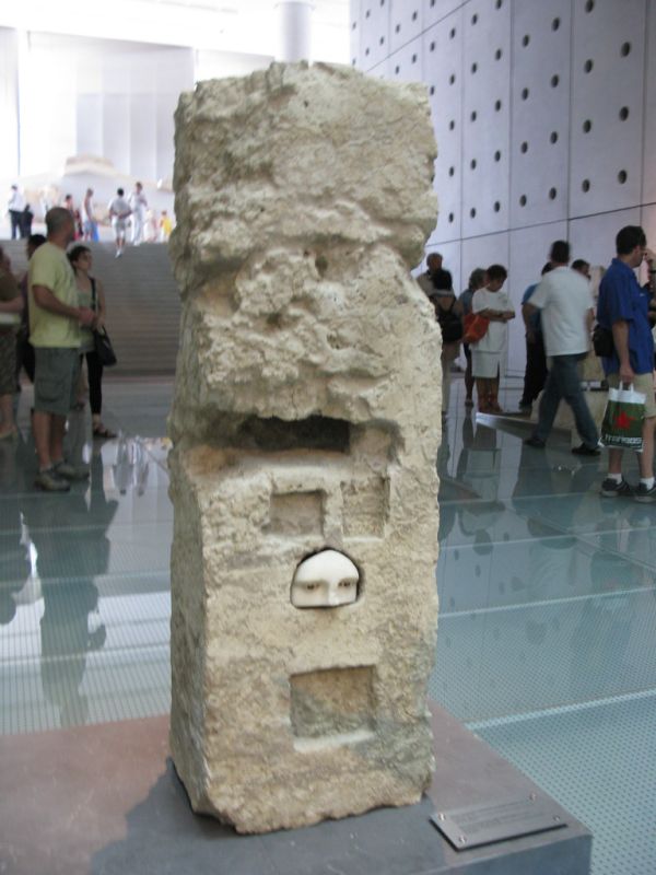 Part of a female face with inlaid eyes. Second half of the 4th cent. BC