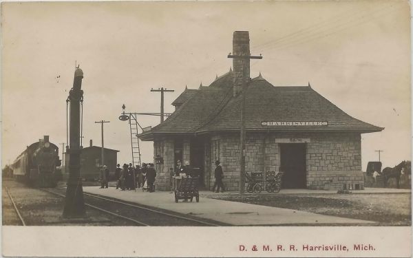 RR NE Harrisville MI RPPC 1908 D&MRR DEPOT Detroit & Mackinac Railroad Harrisville people donate the stone to the Railroad so that that the railway company would build a stone depot
