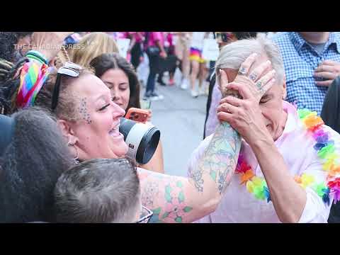 Revellers douse Carney with water at Toronto Pride
